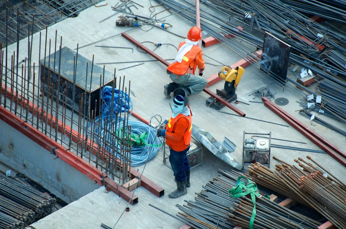 Construction worker in PPE and hardhat at safety compliance site